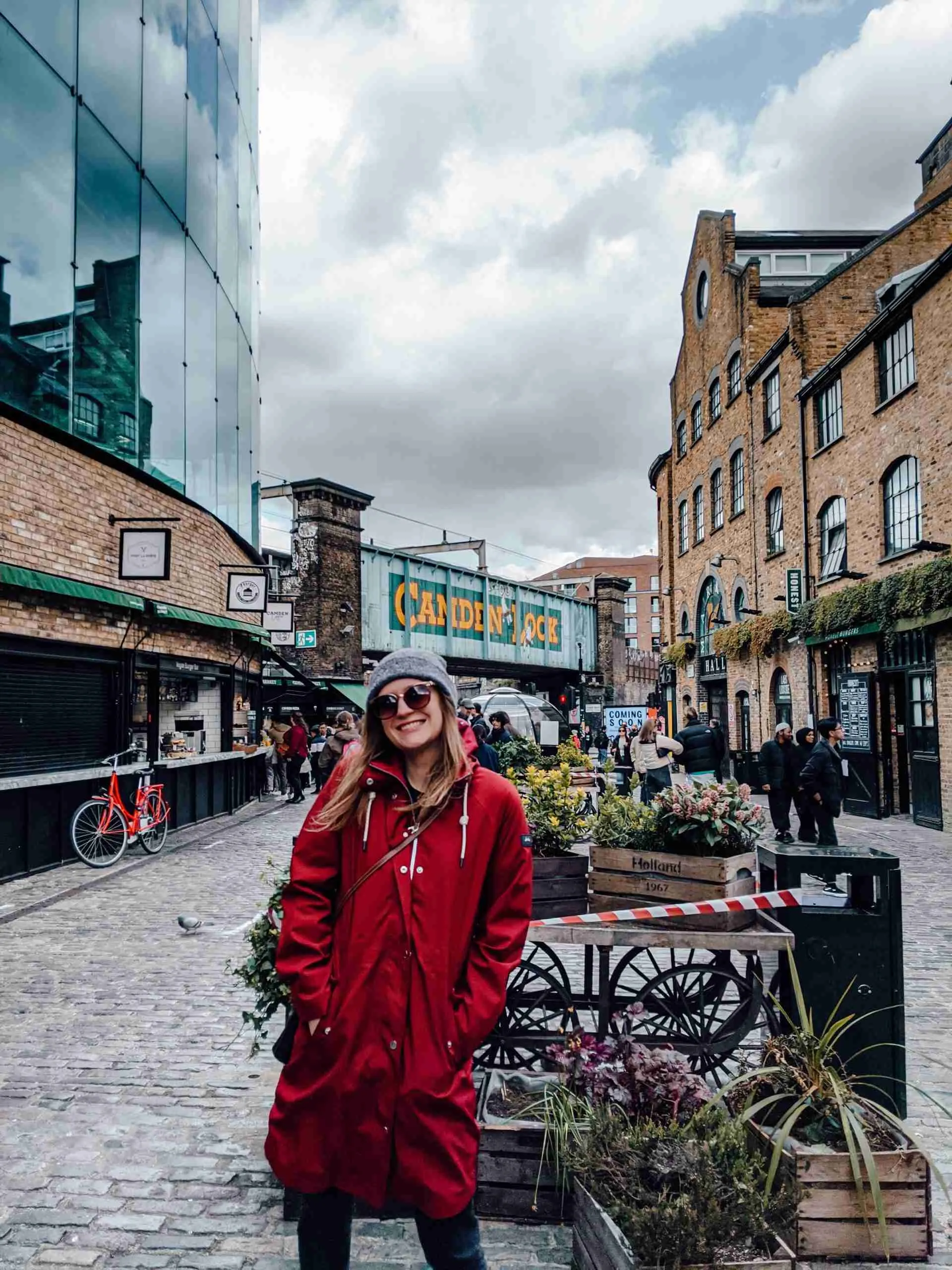 A girl standing in front of the Camden Lock, next to the Camden Market - one of the most iconic markets in London 