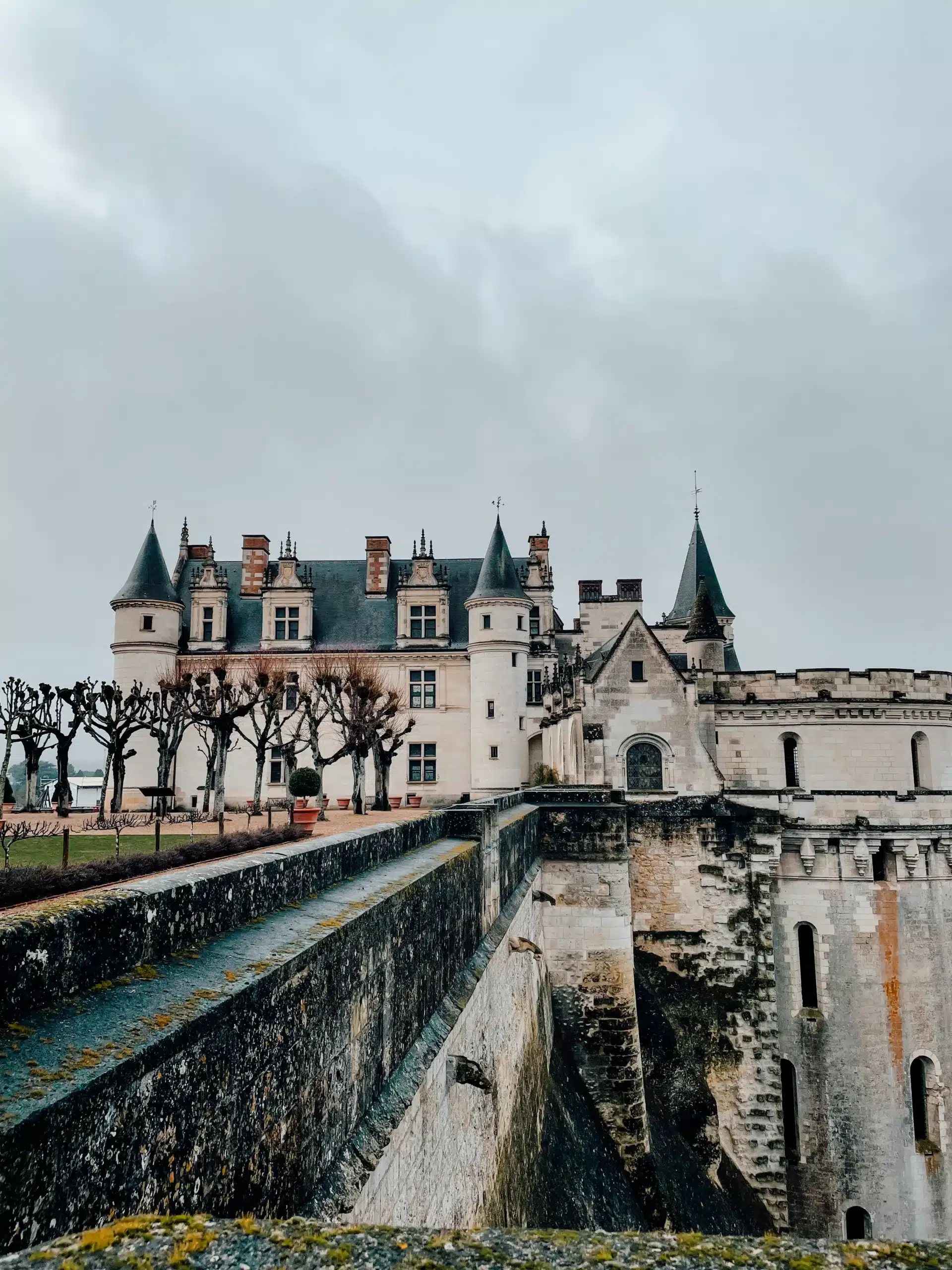 A white french castle in the Loire Valley on a cloudy day 