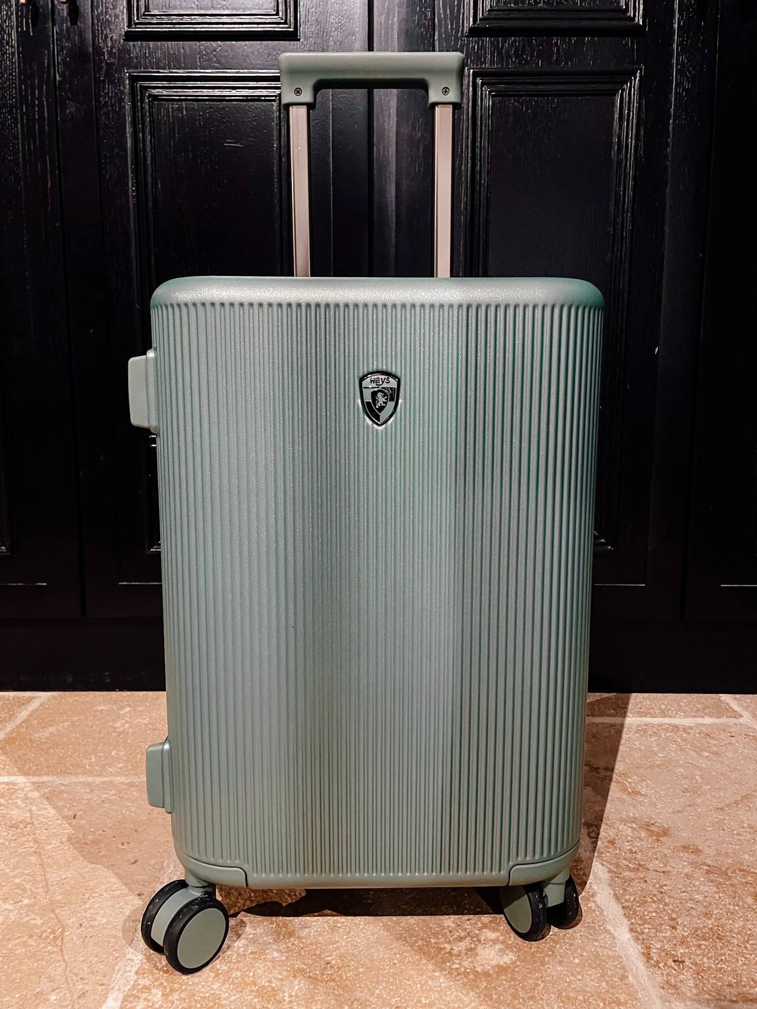 The carry-on size Heys luggage Earth Tones collection in moss.