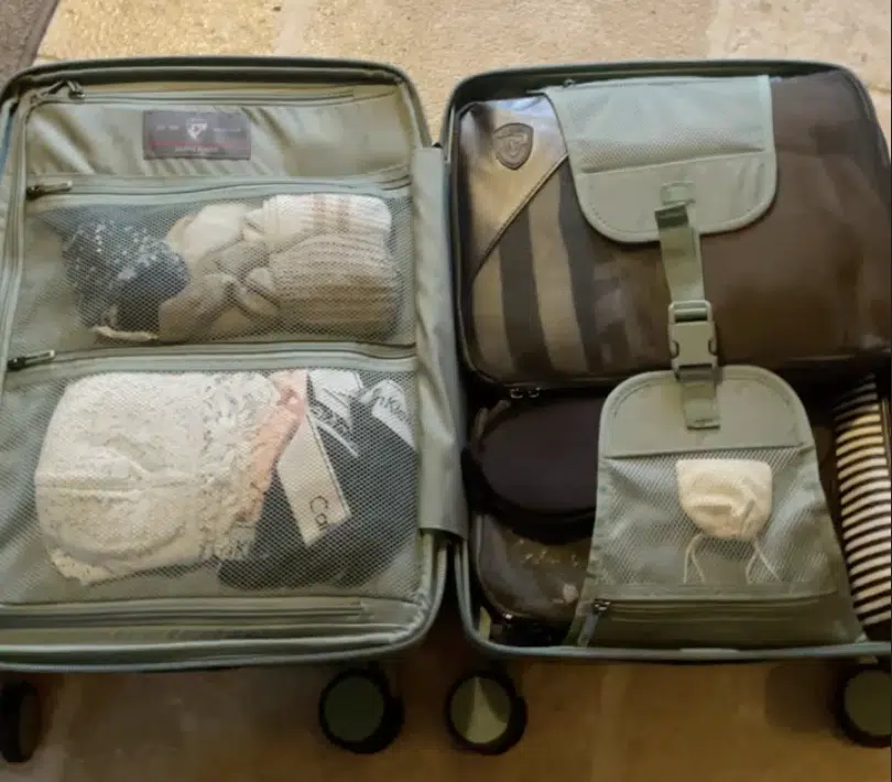 Inside of a suitcase showing how organized packing cubes can make your luggage