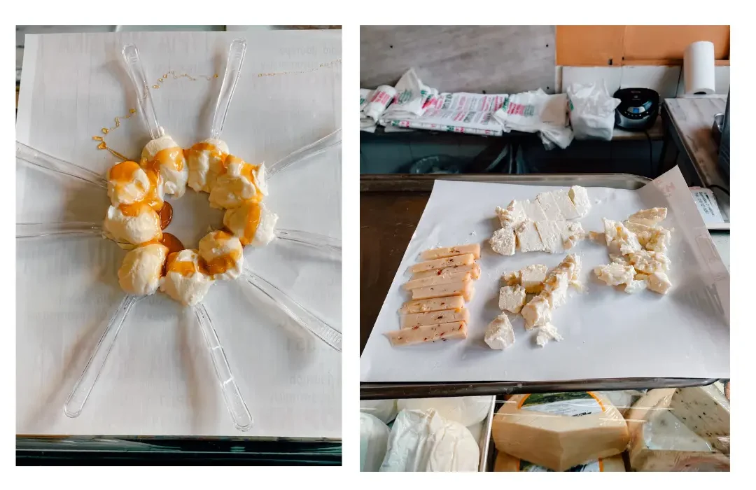 Spoons of greek yoghurt sprinkled with honey sit on display in a circle and a variety of cheeses sit prepared for sampling 