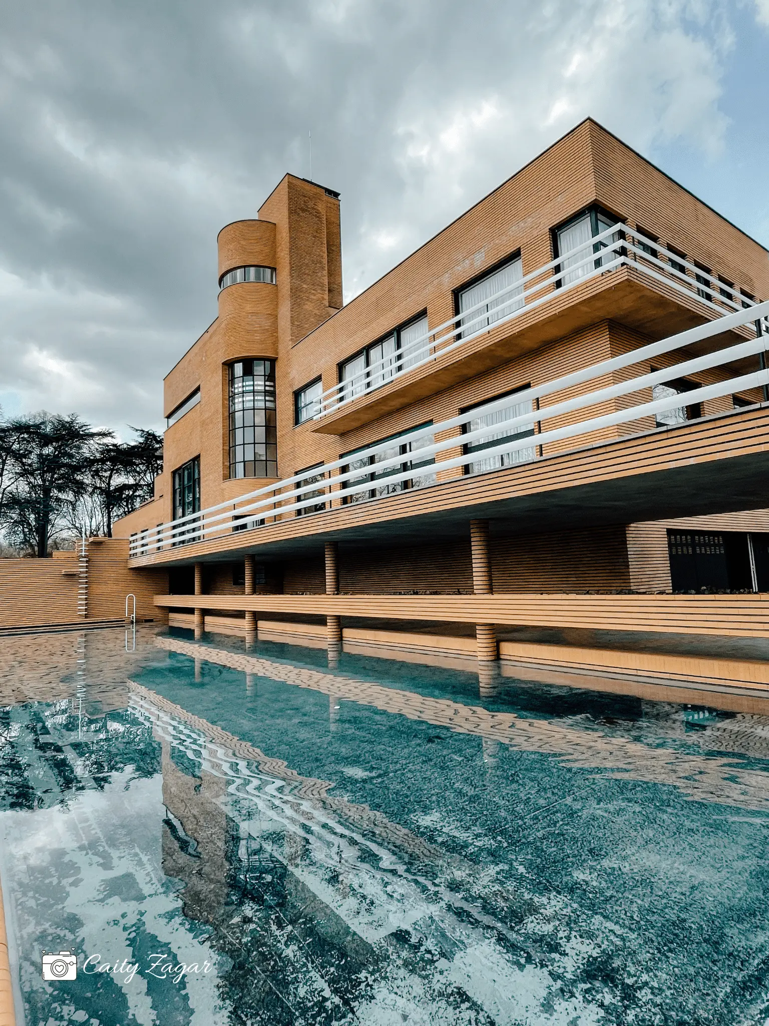 The exterior of Villa Cavrois behind the outdoor swimming pool looking at the geometric shapes that make up this historic villa 