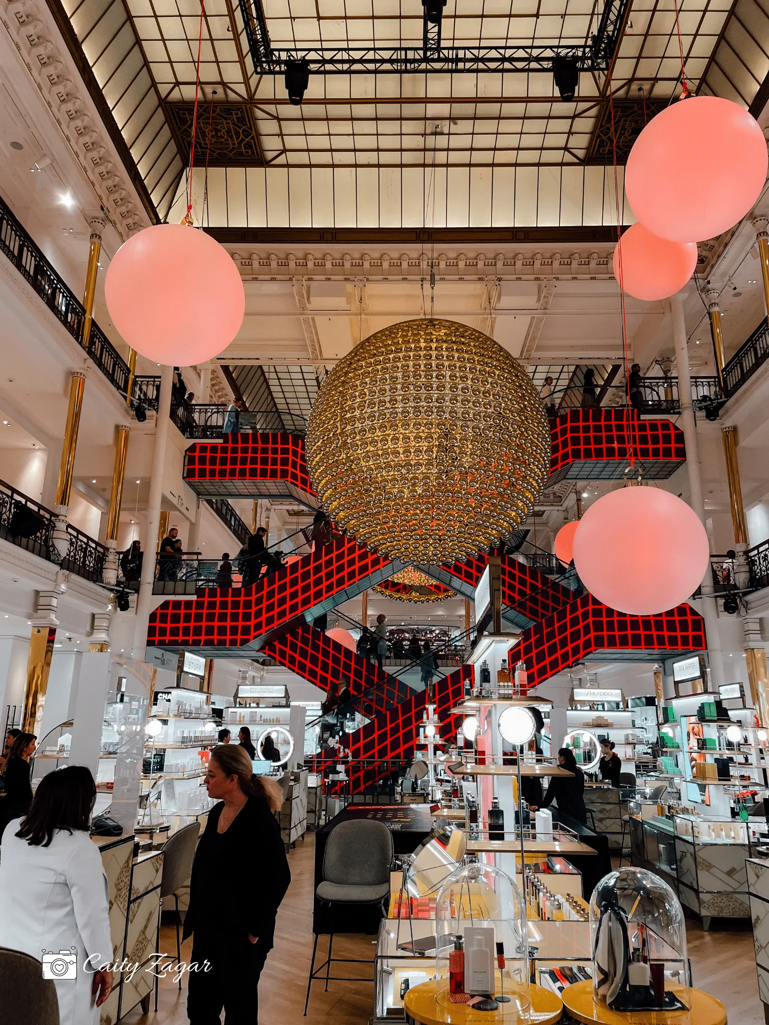 The iconic elevators and holiday displays inside Le Bon Marche