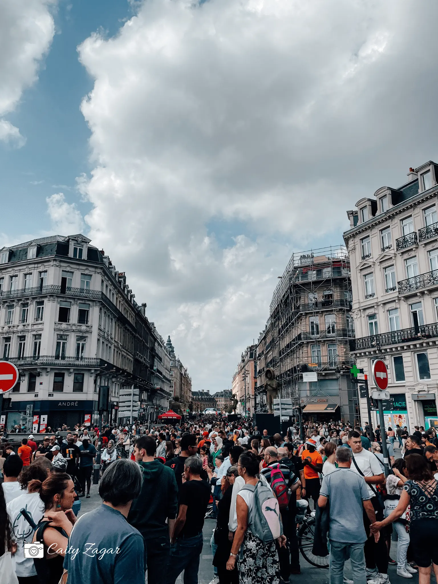 the main street in Lille filled with crowds of people during braderie