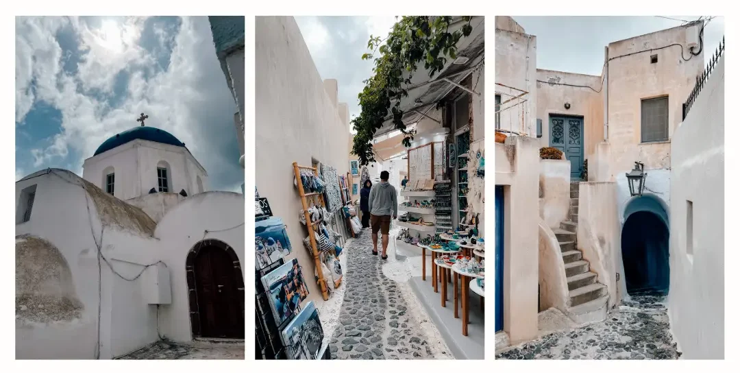 The small winding streets of Pyrgos in Santorini including small souvenir shops and a church.