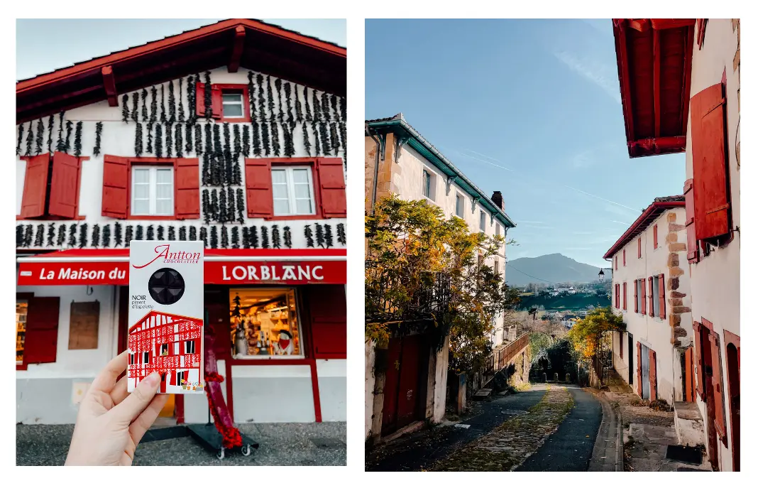 A cute traditional Basque villages with mountains in the distance on a clear sunny day